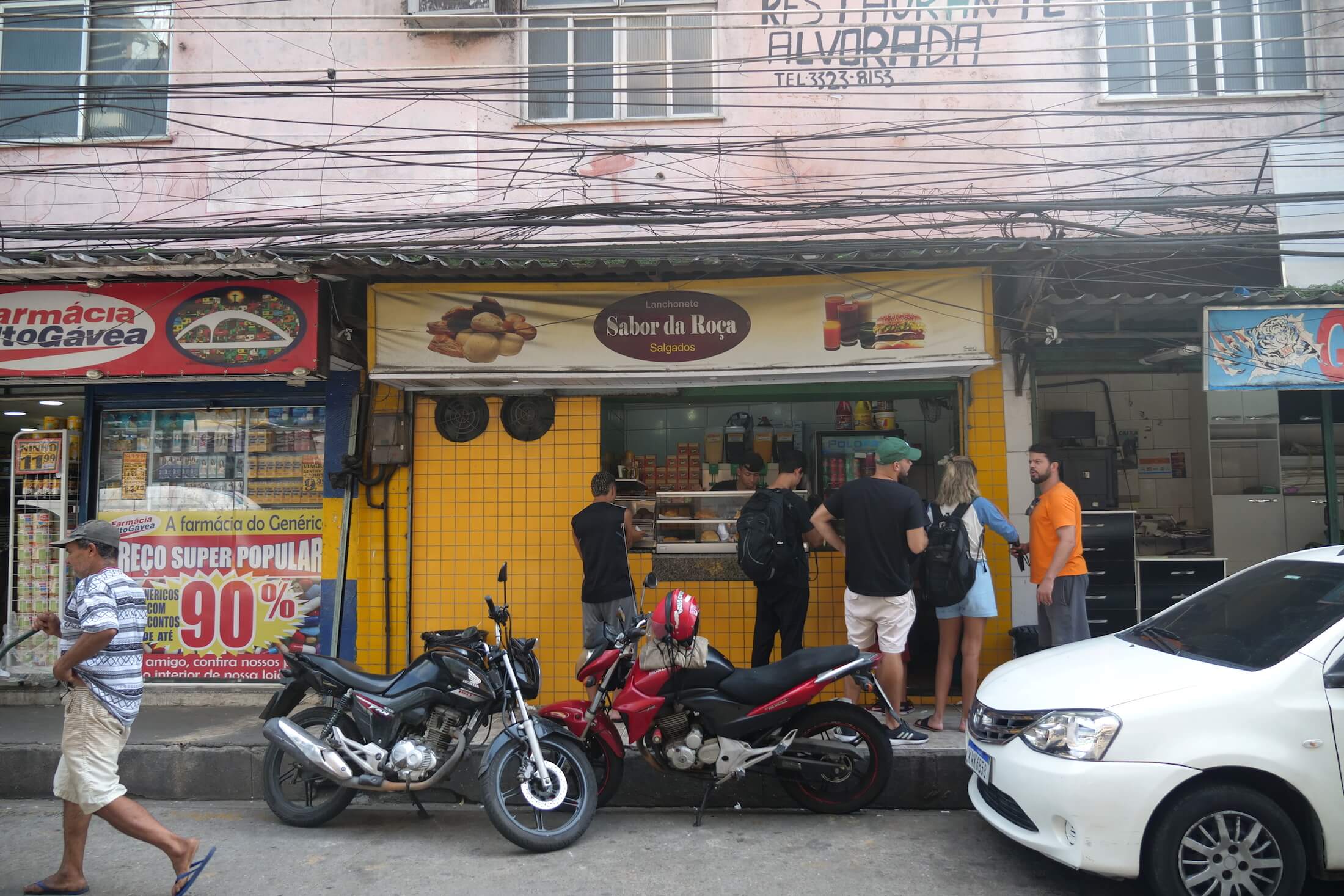 try the snack Coxinha at a small street side store like Sabor da Roca