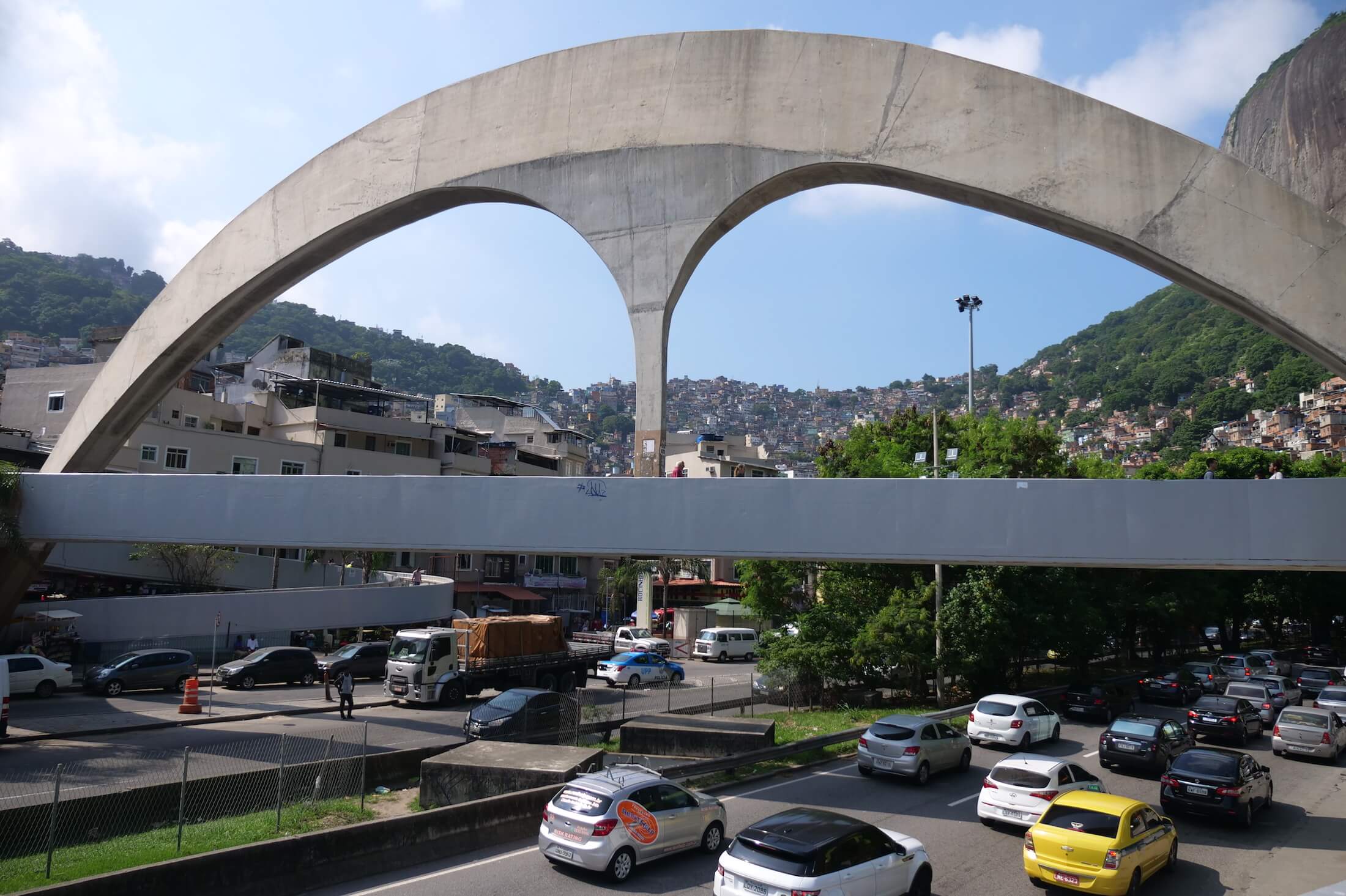 Take a bus, or taxi, and get off when you see this huge arch over the entrance to Rocinha favela